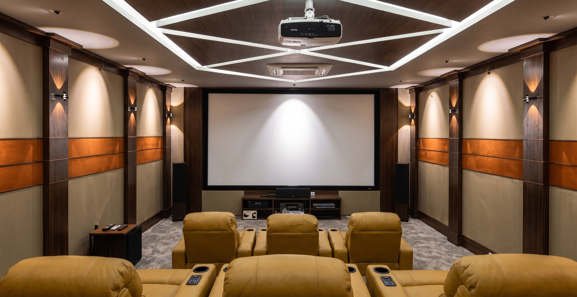Premium home theatre room by Rhythm with acoustic panels and recliners